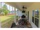 Covered patio with ceiling fans and outdoor dining set, ideal for entertaining at 62 Presley Farm Pkwy, Rockmart, GA 30153