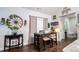 Cozy dining area features a wooden table with storage, seating, and stylish farmhouse decor at 62 Presley Farm Pkwy, Rockmart, GA 30153