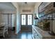 Inviting entryway with double doors, console table with decorative accents, and dark hardwood floors at 62 Presley Farm Pkwy, Rockmart, GA 30153