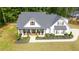 Aerial view of a well-manicured lawn and beautiful home, showcasing its classic design and inviting curb appeal at 62 Presley Farm Pkwy, Rockmart, GA 30153