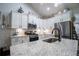Bright kitchen featuring granite countertops, white cabinets, stainless steel appliances, and stylish fixtures at 62 Presley Farm Pkwy, Rockmart, GA 30153