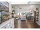 Spacious open-concept living room with high ceilings, fireplace, and views into the kitchen at 62 Presley Farm Pkwy, Rockmart, GA 30153