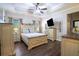 Tranquil main bedroom with tray ceiling, stylish furnishings, and ample natural light at 62 Presley Farm Pkwy, Rockmart, GA 30153