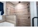 Elegant walk-in shower with tile surround, rainfall showerhead, and glass enclosure at 62 Presley Farm Pkwy, Rockmart, GA 30153
