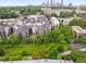 A birds-eye view displays the apartment complex, nearby greenery, and the city skyline in the background at 821 Ralph Mcgill Ne Blvd # 2113, Atlanta, GA 30306