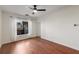 Spacious bedroom with hardwood floors, large window, ceiling fan, and white walls at 821 Ralph Mcgill Ne Blvd # 2113, Atlanta, GA 30306