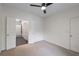 Bright bedroom with neutral carpet, ceiling fan, and access to a bathroom with shower at 821 Ralph Mcgill Ne Blvd # 2113, Atlanta, GA 30306