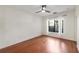 Bedroom with hardwood floors, a ceiling fan, and large window at 821 Ralph Mcgill Ne Blvd # 2113, Atlanta, GA 30306