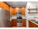 Kitchen features stainless steel appliances, wood cabinets, and granite countertops at 821 Ralph Mcgill Ne Blvd # 2113, Atlanta, GA 30306