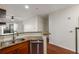 Open concept kitchen featuring a stainless steel sink, appliances, and granite countertops at 821 Ralph Mcgill Ne Blvd # 2113, Atlanta, GA 30306