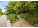 Lush green pathway along the side of a park, perfect for walking and recreation at 821 Ralph Mcgill Ne Blvd # 2113, Atlanta, GA 30306