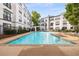 Inviting community pool with lounging chairs, a central fountain, and a meticulously maintained deck at 821 Ralph Mcgill Ne Blvd # 2113, Atlanta, GA 30306