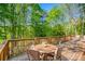 Spacious outdoor deck with seating and lush greenery views, perfect for outdoor dining and gatherings at 2334 Fisher Dr, Loganville, GA 30052