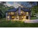 Two-story home with a large deck, backyard, finished basement, and surrounded by lush greenery and trees at 2334 Fisher Dr, Loganville, GA 30052