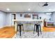 Basement features a custom bar with corrugated metal and comfortable seating at 2334 Fisher Dr, Loganville, GA 30052