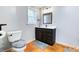 Finished basement bathroom with granite vanity and grey accents at 2334 Fisher Dr, Loganville, GA 30052