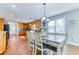 Charming dining area adjacent to the kitchen with hardwood floors, natural light, and seating for six at 2334 Fisher Dr, Loganville, GA 30052