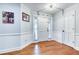 Welcoming front foyer with hardwood floors, wainscoting detail, and bright natural light from sidelight windows at 2334 Fisher Dr, Loganville, GA 30052