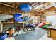 Spacious garage with ample storage, a workbench, and room for a motorcycle and lawn equipment at 2334 Fisher Dr, Loganville, GA 30052