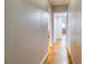 Hallway with wood floors leading to other rooms at 2334 Fisher Dr, Loganville, GA 30052