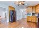 This kitchen boasts updated stainless steel appliances, wood cabinets, and hardwood floors at 2334 Fisher Dr, Loganville, GA 30052