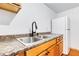 Kitchen featuring stainless steel sink, range, refrigerator and wood cabinets at 2334 Fisher Dr, Loganville, GA 30052