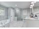 This main bathroom features a walk-in shower, double sink, and separate tub at 2334 Fisher Dr, Loganville, GA 30052