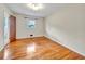Bright bedroom featuring hardwood floors and a window with green outdoor views at 3089 Ranlo Dr, Atlanta, GA 30340