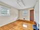 Cozy bedroom featuring hardwood floors, two windows, and ample natural light at 3089 Ranlo Dr, Atlanta, GA 30340
