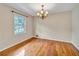 Bright dining room with chandelier and large window with outdoor views at 3089 Ranlo Dr, Atlanta, GA 30340
