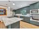 Modern kitchen with stylish blue cabinetry, stainless steel appliances, and marble countertops at 3089 Ranlo Dr, Atlanta, GA 30340