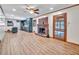 Open-concept living room with fireplace, wood floors, and updated kitchen in view at 3089 Ranlo Dr, Atlanta, GA 30340