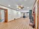Spacious living room featuring wood-look floors, fireplace, and connecting kitchen at 3089 Ranlo Dr, Atlanta, GA 30340