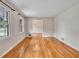 Living room with hardwood floors and windows offering views of the front yard at 3089 Ranlo Dr, Atlanta, GA 30340
