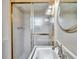Bathroom featuring shower with decorative door and classic sink at 3089 Ranlo Dr, Atlanta, GA 30340