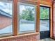 Sunroom with brick trim, multiple windows, and views of the outdoor patio and backyard at 3089 Ranlo Dr, Atlanta, GA 30340