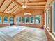 Bright sunroom featuring wood ceiling, brick accents, and abundant natural light from large windows at 3089 Ranlo Dr, Atlanta, GA 30340