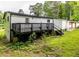 Home with back deck, siding, white painted brick, and wooded views at 493 Woods Nw Dr, Atlanta, GA 30318
