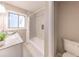 Bathroom featuring white marble tile in the shower and floor, a white vanity, and updated fixtures at 493 Woods Nw Dr, Atlanta, GA 30318