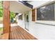 Covered front porch featuring wooden beams and a charming exterior at 493 Woods Nw Dr, Atlanta, GA 30318