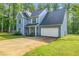 Lovely two-story home with an attached two-car garage and a well-kept lawn at 5652 Burruss Rd, Cumming, GA 30028