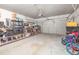 Spacious garage with ample storage, workbench, and a multi-panel door for easy access at 5652 Burruss Rd, Cumming, GA 30028