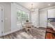Bright kitchen nook featuring a window and breakfast table with seating at 5652 Burruss Rd, Cumming, GA 30028