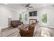 Comfortable living room featuring a fireplace and plenty of natural light at 5652 Burruss Rd, Cumming, GA 30028