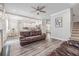 Open floor plan view from living room to the gourmet kitchen and eating area at 5652 Burruss Rd, Cumming, GA 30028