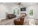 Comfortable living room featuring a fireplace and plenty of natural light at 5652 Burruss Rd, Cumming, GA 30028