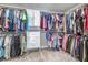 Spacious walk-in closet with custom shelves and hanging rods at 5652 Burruss Rd, Cumming, GA 30028