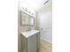 Bathroom with modern vanity, gray cabinets, sink, lighting, and mirror at 788 Fayetteville Se Rd, Atlanta, GA 30316