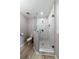 Bathroom with glass shower enclosure with marble wall tile and modern fixtures at 788 Fayetteville Se Rd, Atlanta, GA 30316