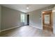 Bedroom with fan, wood-look floors, closet, and lots of natural light at 788 Fayetteville Se Rd, Atlanta, GA 30316